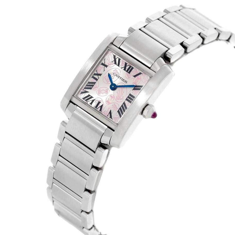 The image shows a Tank Francaise watch by Cartier, angled to highlight its rectangular face, Roman numerals, and metal bracelet.