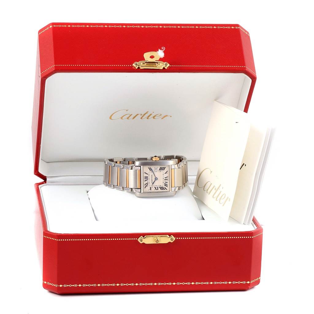 The Cartier Tank Francaise W51012Q4 Women's Steel and Gold (two tone) Silver Dial W51012Q4 Women's Steel and Gold (two tone) Silver Dial watch is shown in its open red box alongside booklets, viewed from a frontal angle.