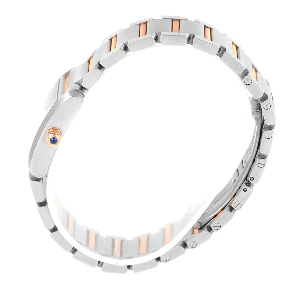 The image shows a side view of a Tank Francaise model watch by Cartier, highlighting the bracelet and crown.