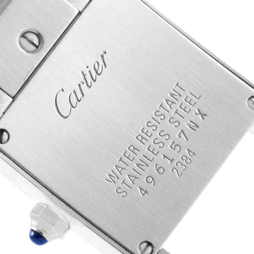 The image shows the back of the Tank Francaise watch by Cartier, highlighting the brand engraving and model details.