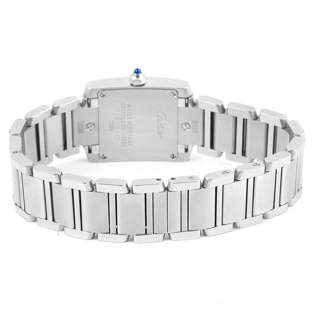 The image shows the back view of a Cartier Tank Francaise W51008Q3 Women's Stainless Steel Silver Dial W51008Q3 Women's Stainless Steel Silver Dial watch, highlighting its stainless steel bracelet and caseback.
