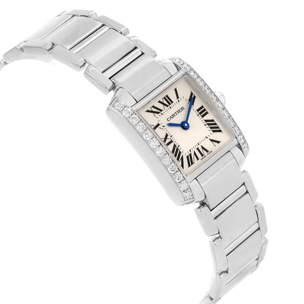 The Cartier Tank Francaise WE1002S3 Women's White Gold Silver Dial WE1002S3 Women's White Gold Silver Dial watch is shown at an angled view highlighting its rectangular face, Roman numerals, and metallic bracelet.