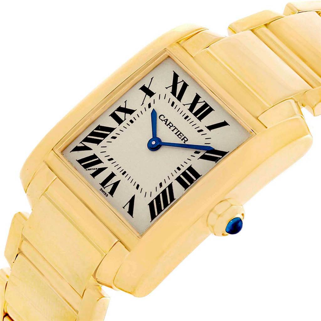This image shows a close-up angle of a Cartier Tank Francaise W50003N2 Women's Yellow Gold Silver Dial W50003N2 Women's Yellow Gold Silver Dial watch, highlighting the face, Roman numerals, and part of the bracelet.