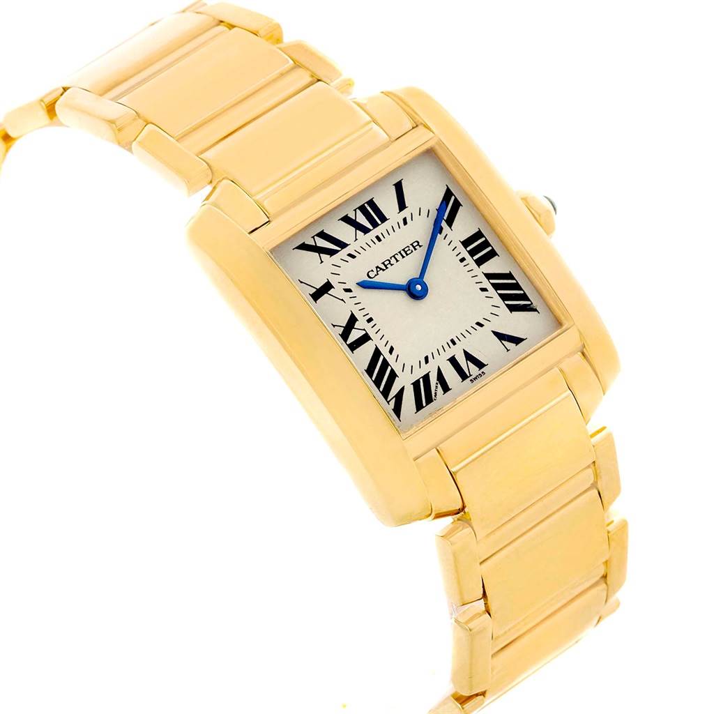 The Cartier Tank Francaise W50003N2 Women's Yellow Gold Silver Dial W50003N2 Women's Yellow Gold Silver Dial watch is pictured at an angle showing the face, bracelet, and part of the crown.