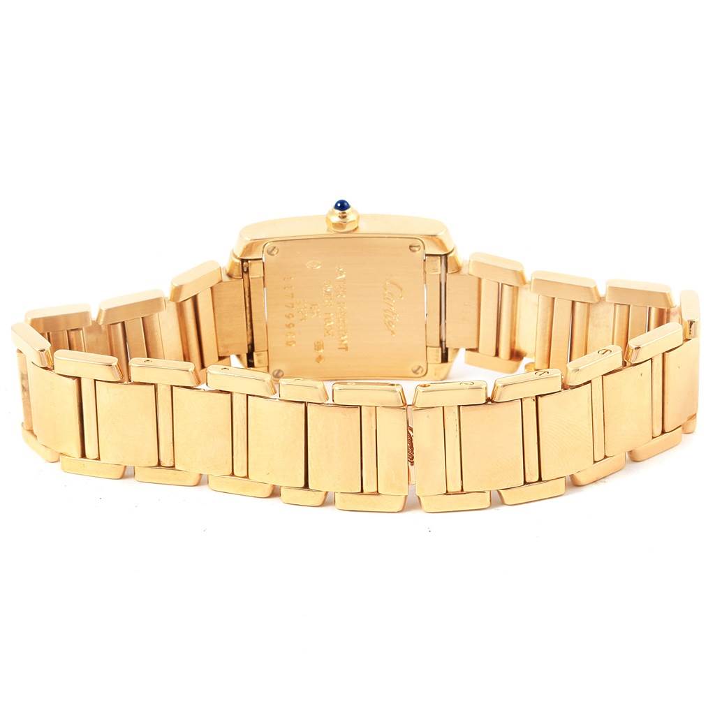 The image shows the back view of a Cartier Tank Francaise W50002N2 Women's Yellow Gold Silver Dial W50002N2 Women's Yellow Gold Silver Dial watch, highlighting its gold bracelet and case back.