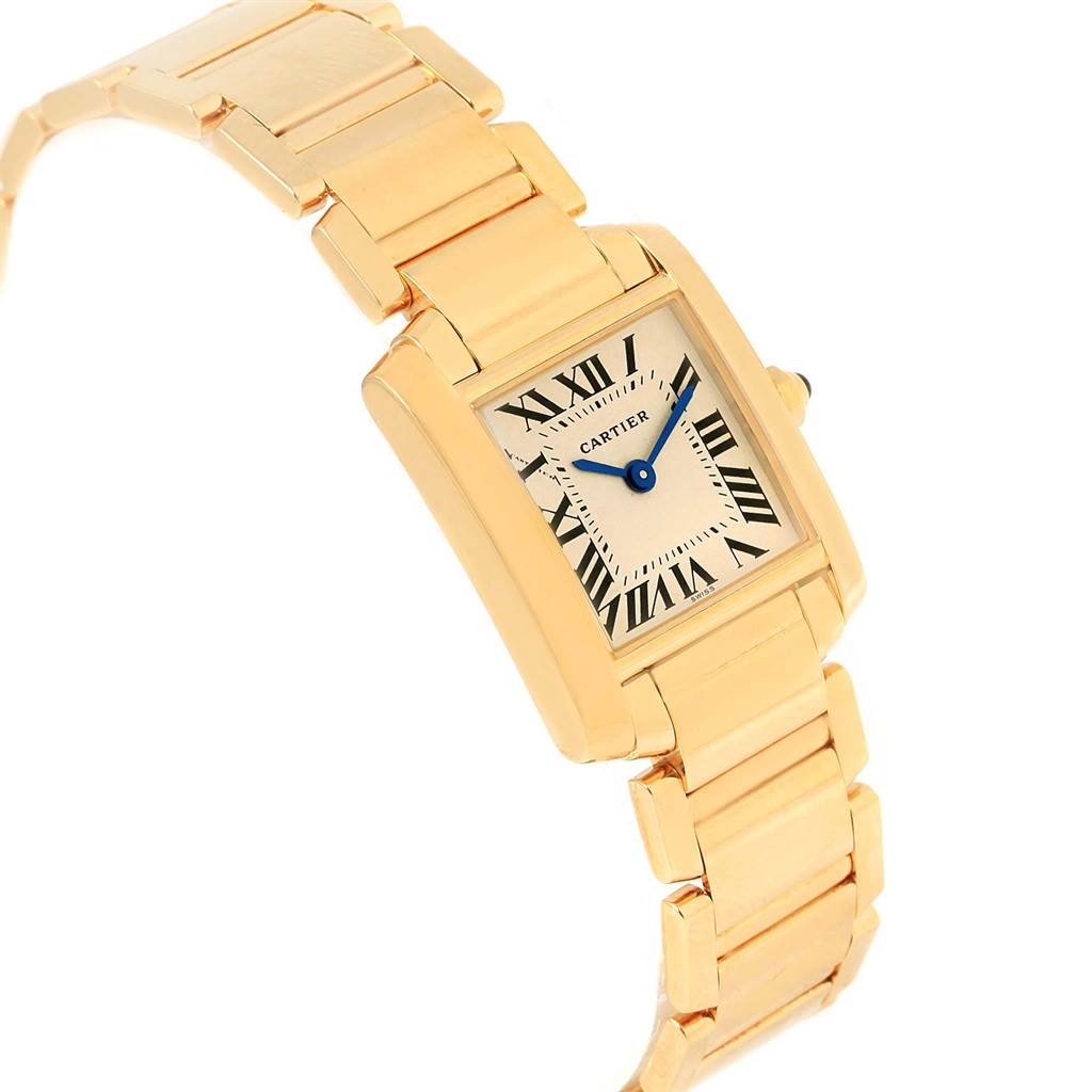 The image shows a Cartier Tank Française wristwatch from a front three-quarter angle, highlighting its gold rectangular case and metal bracelet.