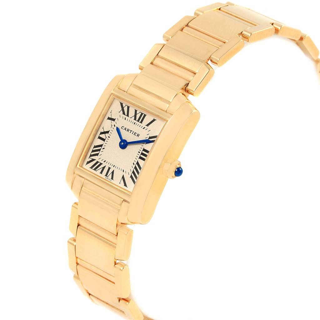 This image shows a Cartier Tank Francaise W50002N2 Women's Yellow Gold Silver Dial W50002N2 Women's Yellow Gold Silver Dial watch at an angle, highlighting its gold rectangular case, Roman numeral dial, and metal bracelet.