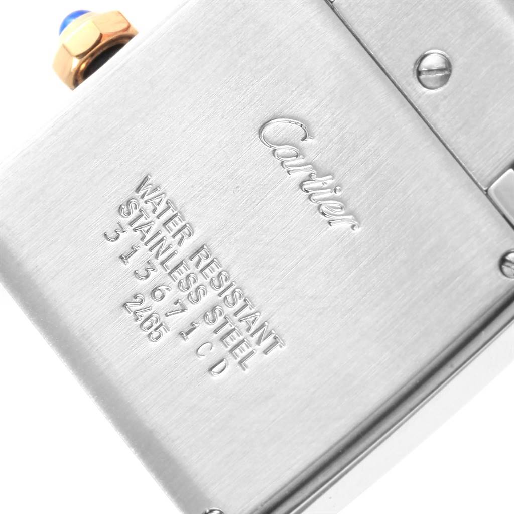 The image shows the back of a Cartier Tank Francaise W51012Q4 Women's Steel and Gold (two tone) Silver Dial W51012Q4 Women's Steel and Gold (two tone) Silver Dial watch, highlighting the brand engraving and model details.