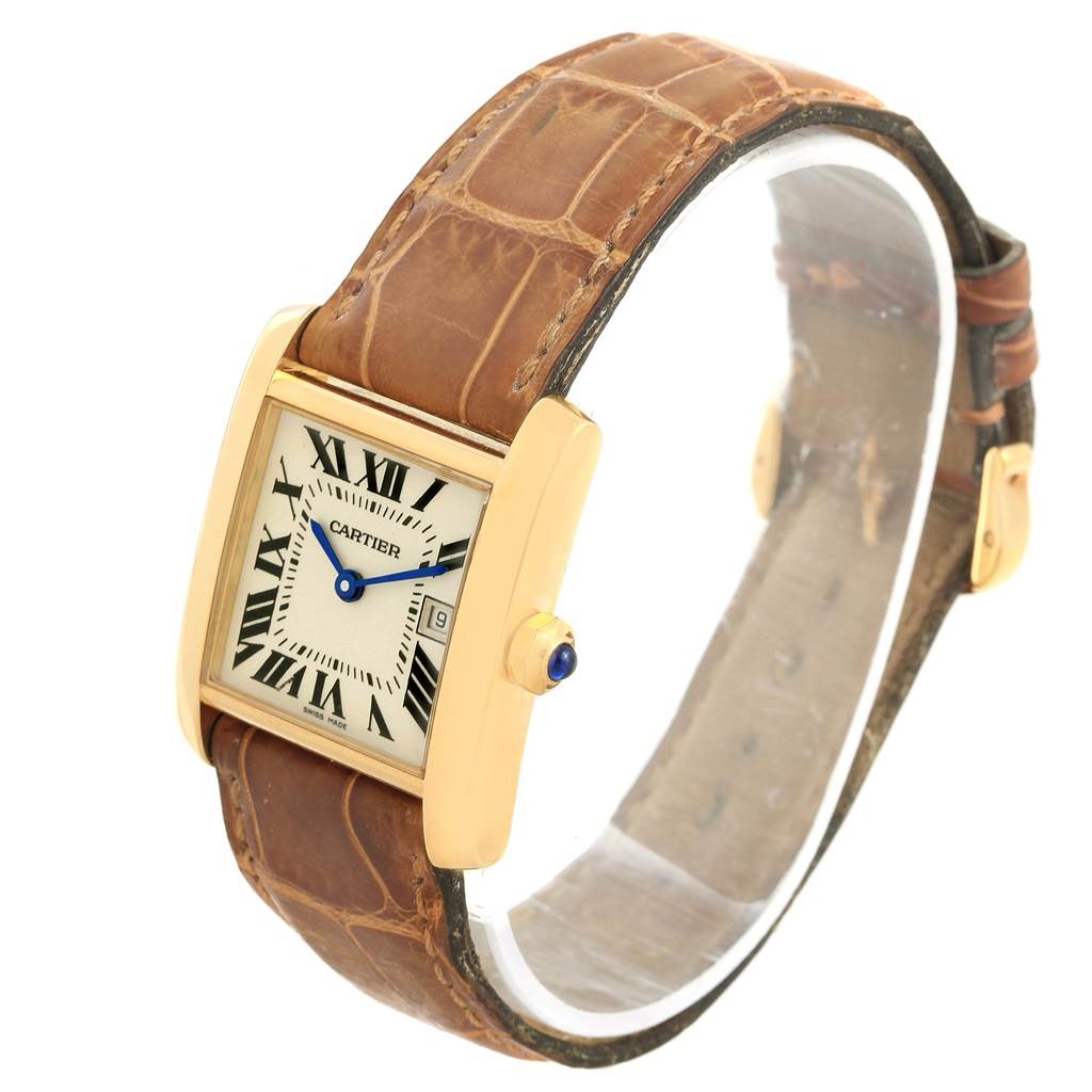 The image shows a Cartier Tank Française watch at an oblique angle, highlighting its face, strap, and crown.