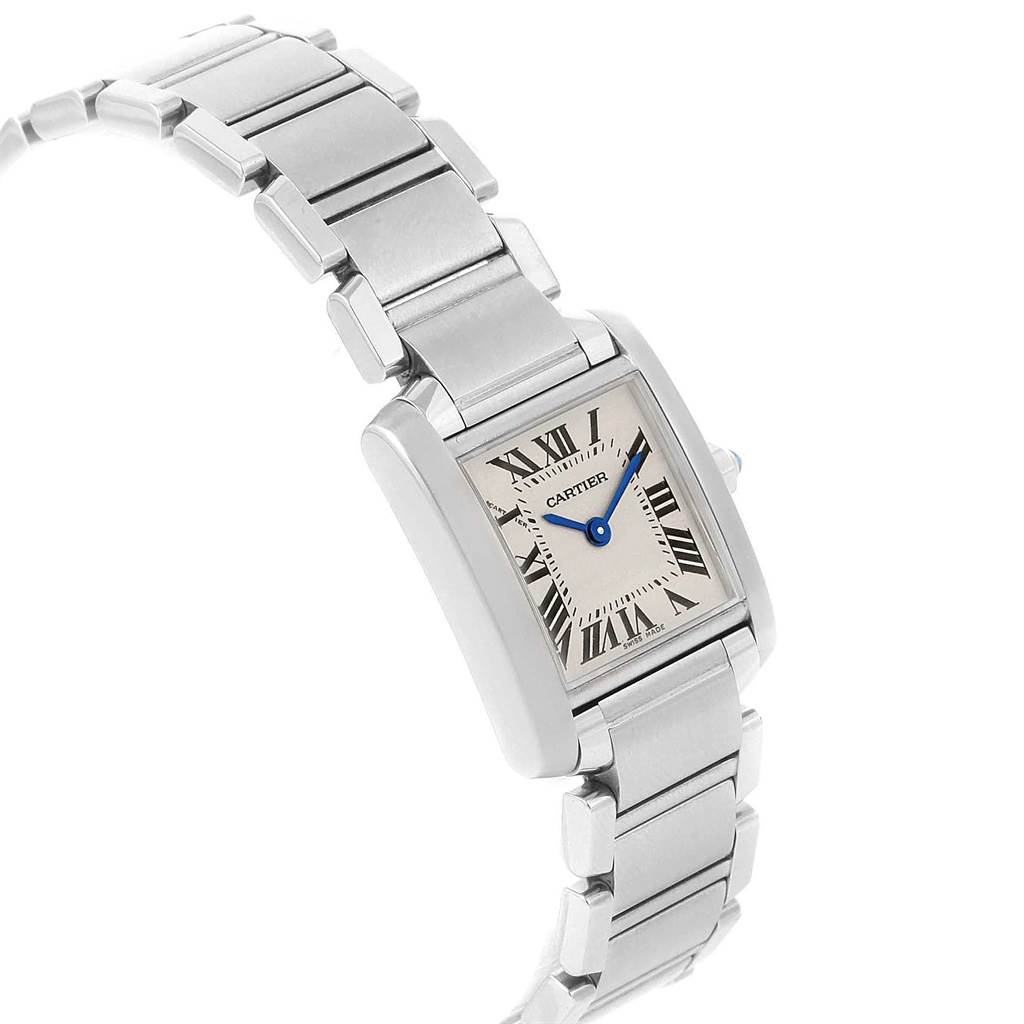The image shows a Tank Française watch by Cartier from a slight angle, highlighting its rectangular face and metal bracelet.