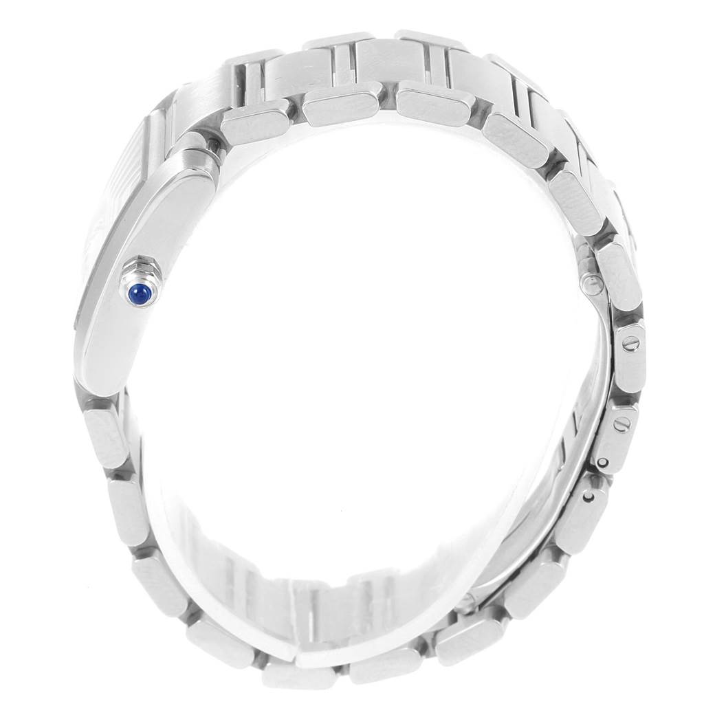 This image shows a side angle of the bracelet and crown of a Cartier Tank Française watch.
