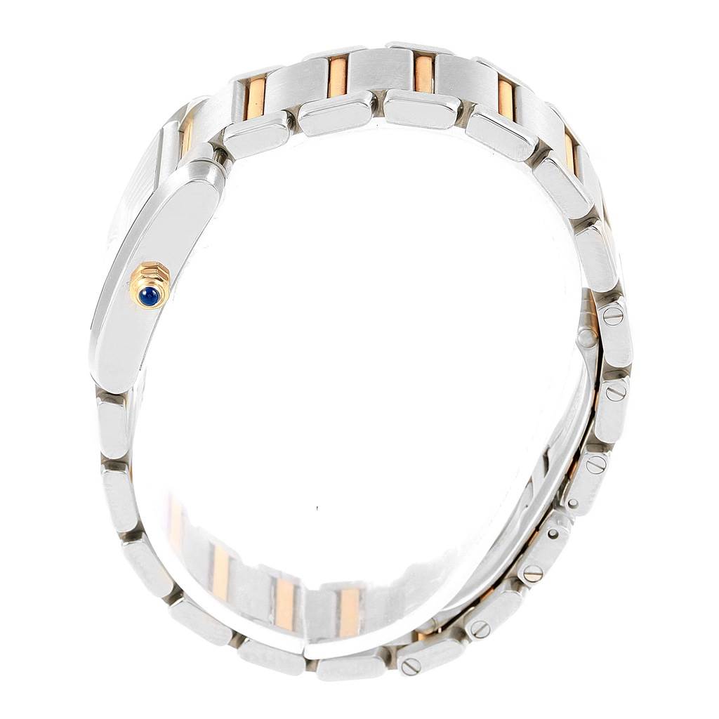 The image shows the side view of the strap and case of a Cartier Tank Francaise W51007Q4 Women's Steel and Gold (two tone) Silver Dial W51007Q4 Women's Steel and Gold (two tone) Silver Dial watch, highlighting the bracelet and crown.
