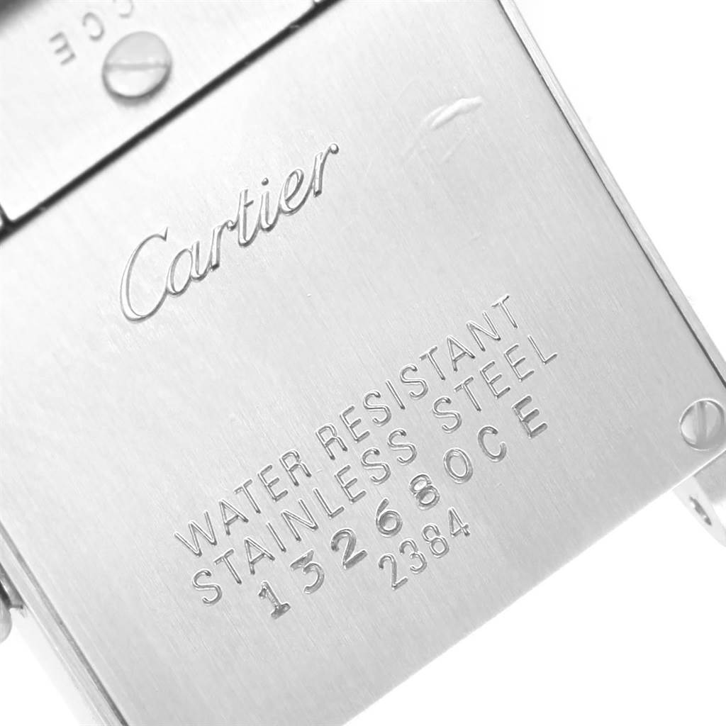 This image shows the back case of a Cartier Tank Française watch, highlighting the brand name and specifications.