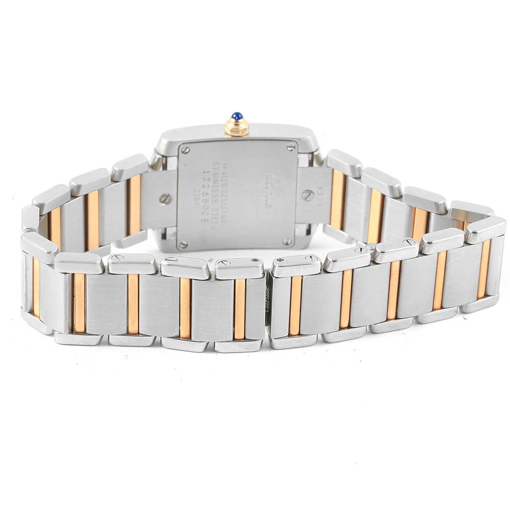 The image shows the back and bracelet of a Cartier Tank Française watch with a two-tone metal bracelet.