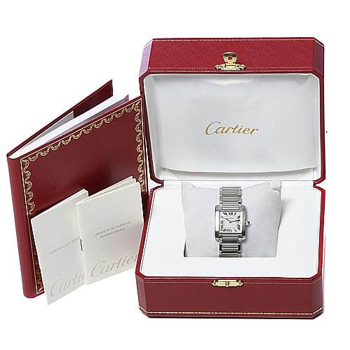 The image shows a Cartier Tank Française watch inside its box, accompanied by booklets, viewed from a frontal angle.