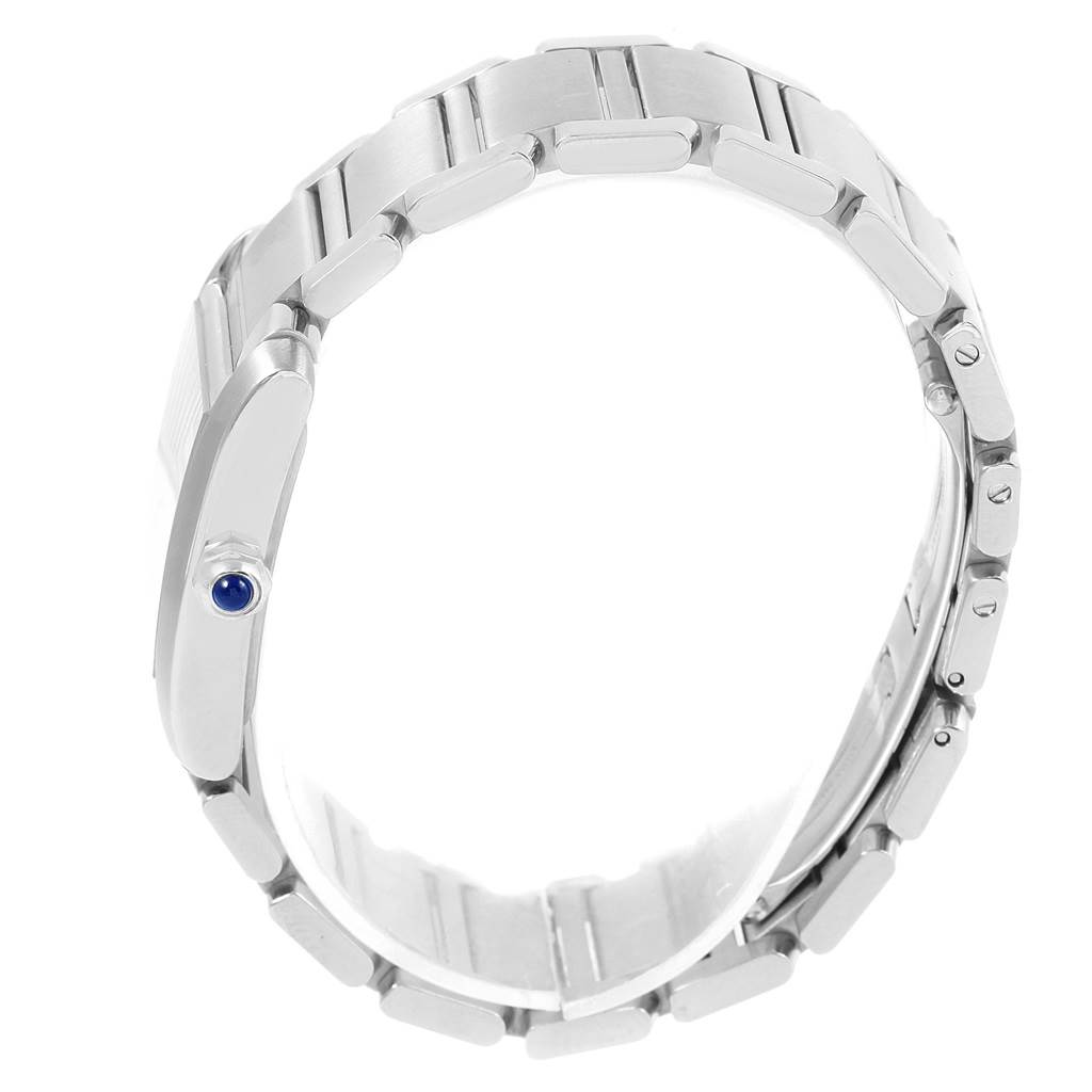 This image shows the side view of a Cartier Tank Française watch, focusing on the bracelet and crown with a blue cabochon.