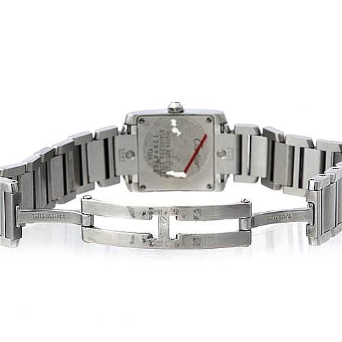 The image shows the back view of a Cartier Tank Française watch with its stainless steel bracelet and clasp fully extended.