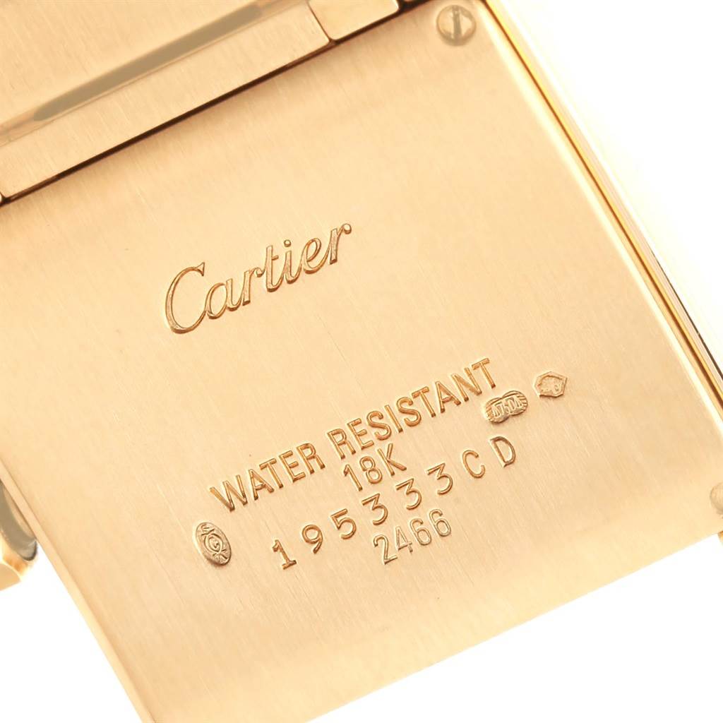 This image shows the back of the Cartier Tank Francaise W50014N2 Women's Yellow Gold Silver Dial W50014N2 Women's Yellow Gold Silver Dial watch, highlighting the brand engraving and specifications.