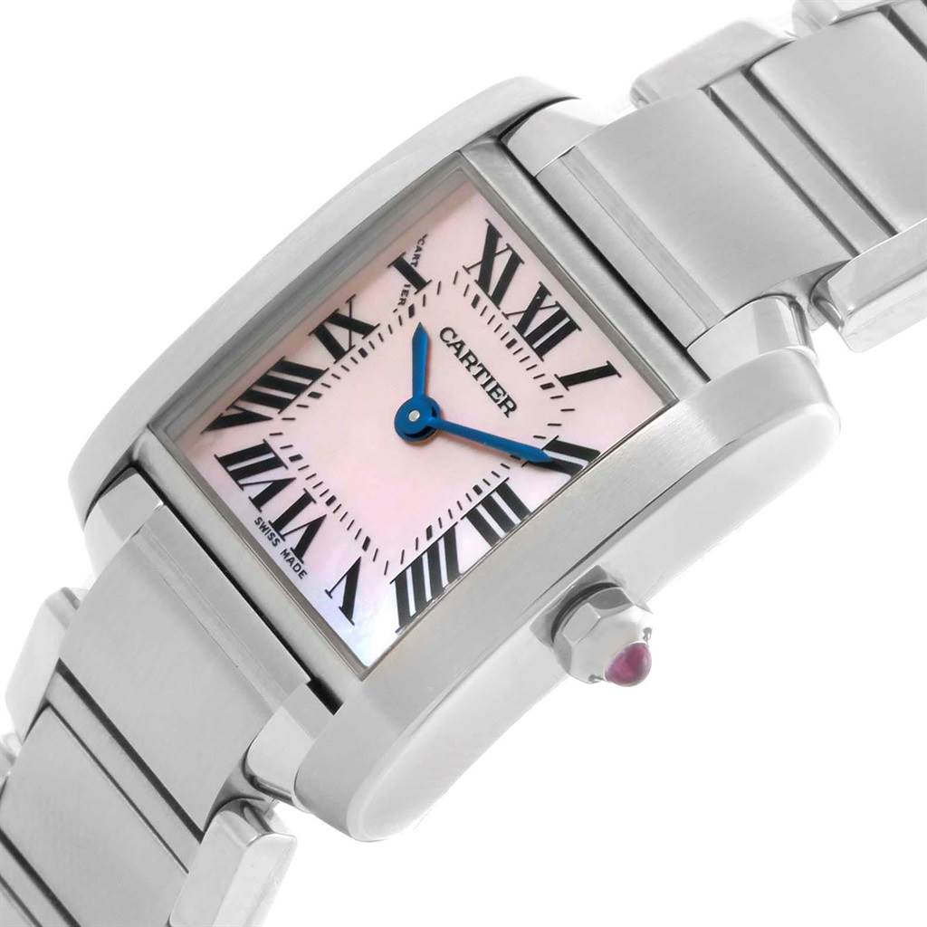 The Tank Francaise by Cartier is shown at an angled view, highlighting its dial, Roman numerals, bracelet, and crown with a gemstone.