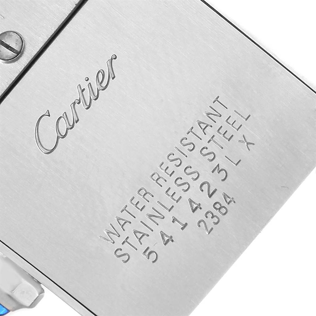 This image shows a close-up of the back case of a Cartier Tank Francaise W51008Q3 Women's Stainless Steel Silver Dial W51008Q3 Women's Stainless Steel Silver Dial watch, highlighting the engraved details.