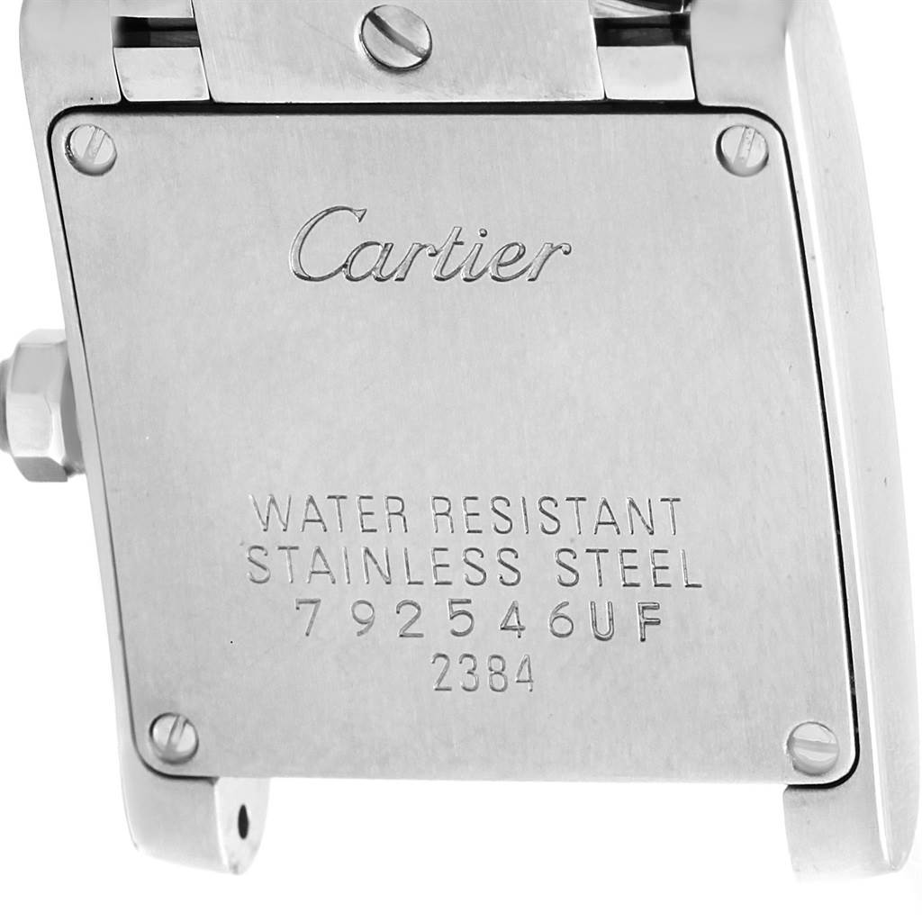 The image shows the back case of a Tank Française model watch by Cartier, displaying its water resistance and stainless steel material.