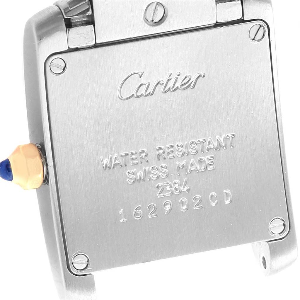 This image shows the back case of a Cartier Tank Francaise W51007Q4 Women's Steel and Gold (two tone) Silver Dial W51007Q4 Women's Steel and Gold (two tone) Silver Dial watch, highlighting the brand engraving and model details.