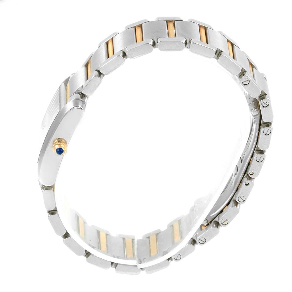 Side view of the Cartier Tank Francaise W51007Q4 Women's Steel and Gold (two tone) Silver Dial W51007Q4 Women's Steel and Gold (two tone) Silver Dial watch showing the bracelet with gold accents and crown.