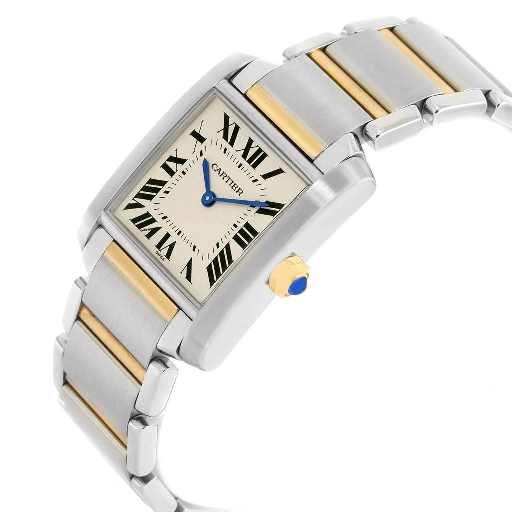 The image shows a Cartier Tank Francaise W2TA0003 Women's Steel and Gold (two tone) Silver Dial W2TA0003 Women's Steel and Gold (two tone) Silver Dial watch at an angled view, highlighting its rectangular face, Roman numerals, and two-tone bracelet.