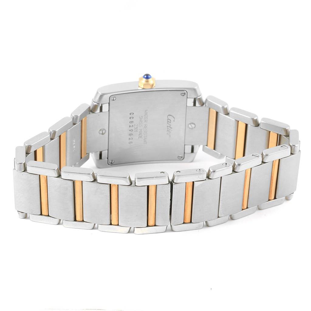 The image shows the back view of a Cartier Tank Francaise W2TA0003 Women's Steel and Gold (two tone) Silver Dial W2TA0003 Women's Steel and Gold (two tone) Silver Dial watch, highlighting its two-tone bracelet and case back.