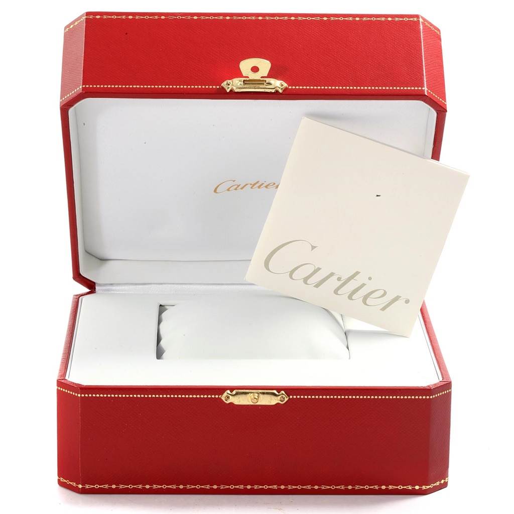 The image shows an open Cartier Tank Francaise W50002N2 Women's Yellow Gold Silver Dial W50002N2 Women's Yellow Gold Silver Dial watch box with a cushion and a Cartier booklet inside.