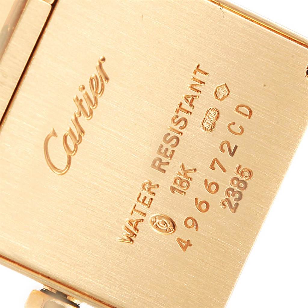 The image shows the back case of a Cartier Tank Francaise W50002N2 Women's Yellow Gold Silver Dial W50002N2 Women's Yellow Gold Silver Dial watch with water resistance and 18K gold markings.