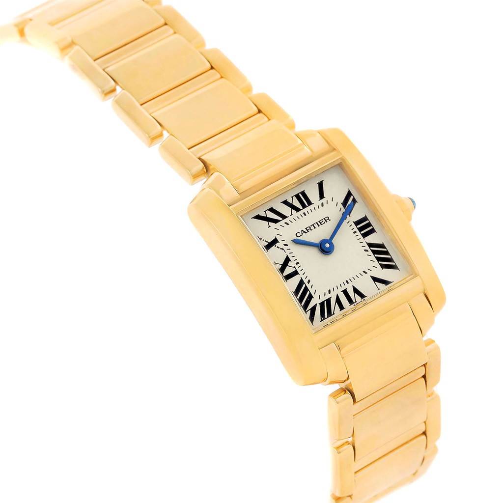 The image shows a Cartier Tank Francaise W50002N2 Women's Yellow Gold Silver Dial W50002N2 Women's Yellow Gold Silver Dial watch, highlighting its gold bracelet and rectangular face with Roman numeral markers.