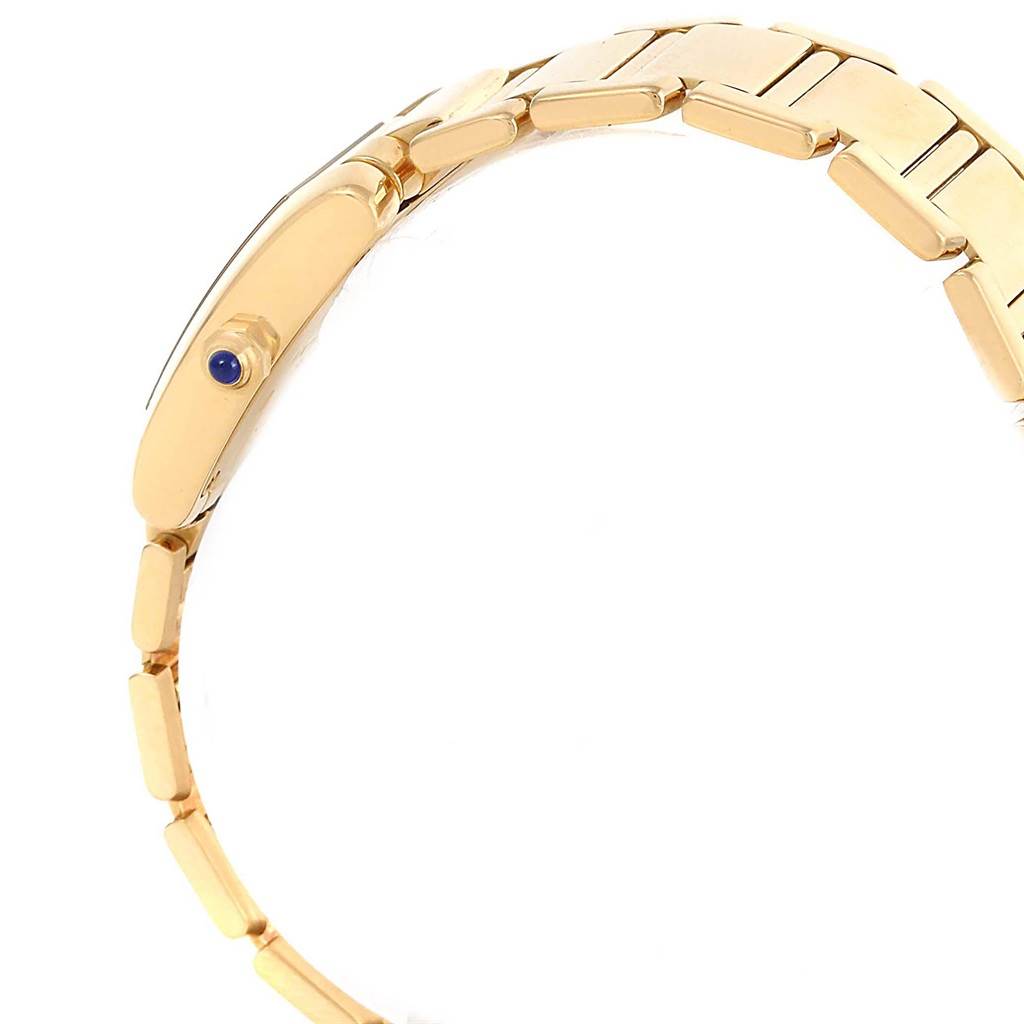 The image shows a side view of a Cartier Tank Francaise W50002N2 Women's Yellow Gold Silver Dial W50002N2 Women's Yellow Gold Silver Dial watch, highlighting its bracelet and crown with a blue cabochon.