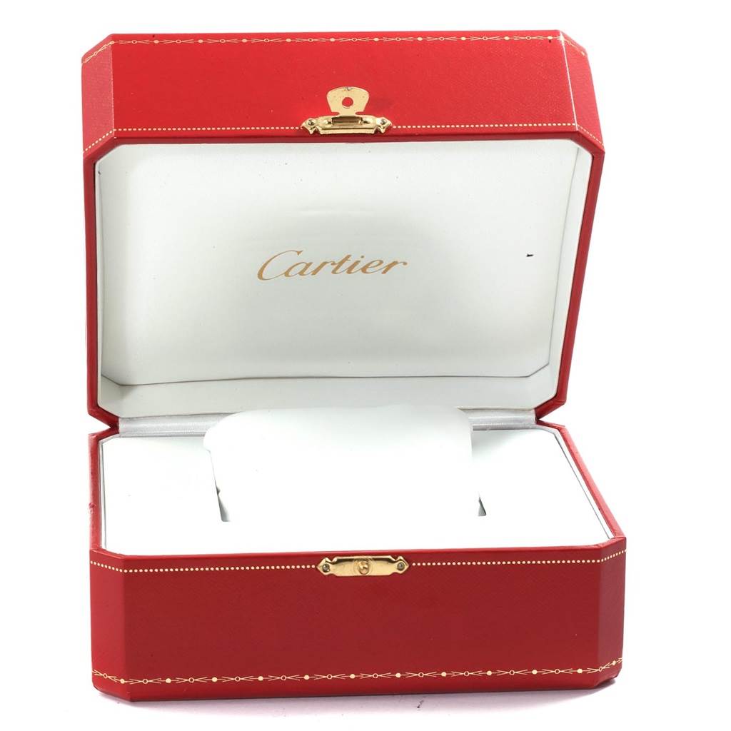 The image shows an open red Cartier box for the Tank Française model watch, featuring the brand's logo inside the lid.