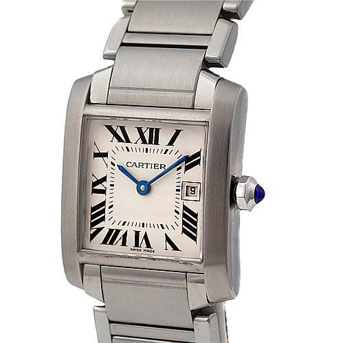 The image shows a close-up of the Cartier Tank Française watch, highlighting its face, bracelet, and crown with a blue cabochon.