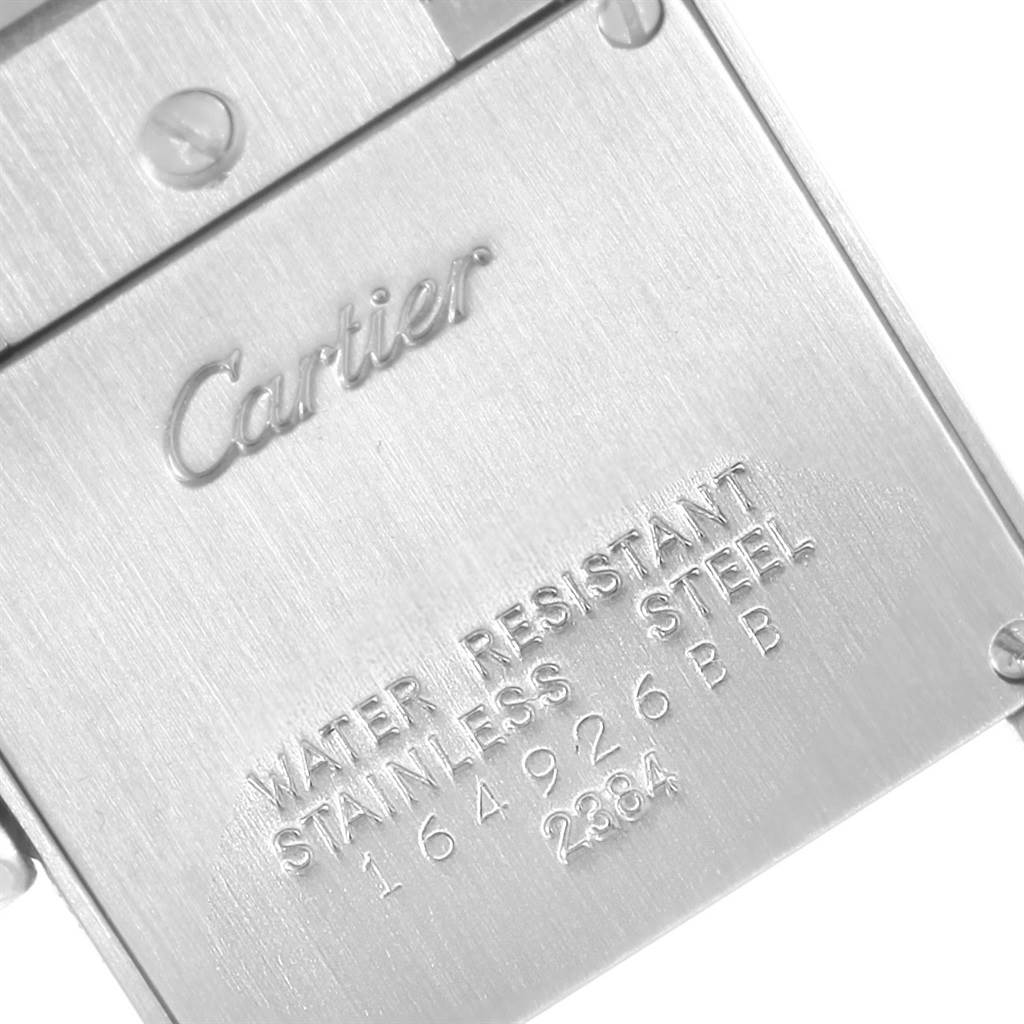 This image shows the stainless steel case back of a Cartier Tank Francaise W51028Q3 Women's Stainless Steel Mother of Pearl Dial W51028Q3 Women's Stainless Steel Mother of Pearl Dial watch, highlighting the brand name and serial numbers.