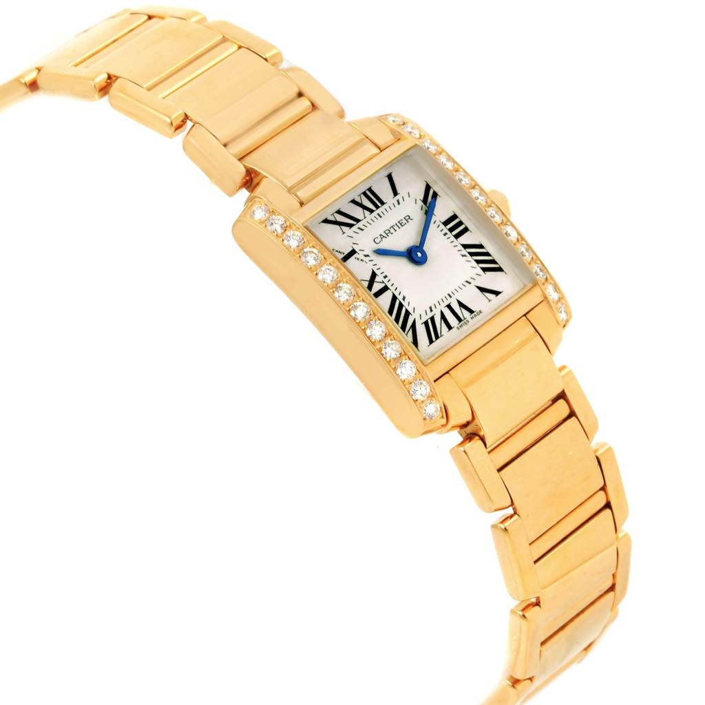 This Cartier Tank Française watch is shown at a side angle, highlighting its rectangular face, gold bracelet, and diamond-studded bezel.