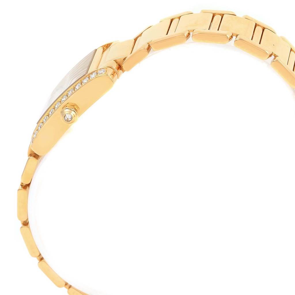This image shows a side view of the Cartier Tank Francaise WE1001R8 Women's Yellow Gold Silver Dial WE1001R8 Women's Yellow Gold Silver Dial watch, highlighting part of the band and the diamond-set bezel.