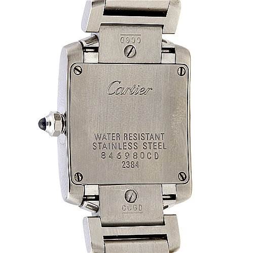 The image shows the back case of a Cartier Tank Française watch, displaying its water resistance and stainless steel markings.