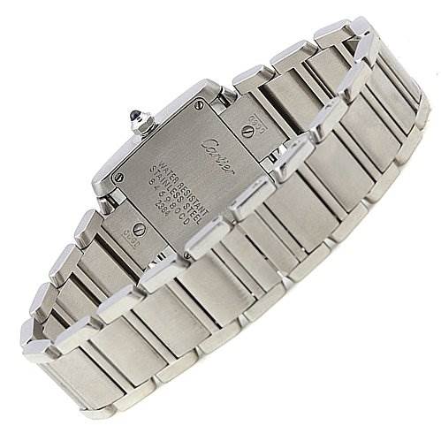 The image shows the back and part of the bracelet of a Cartier Tank Française watch, highlighting its stainless steel construction and clasp.