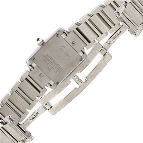 The image shows the clasp and the backside of the Tank Francaise watch by Cartier, highlighting its stainless steel bracelet and backplate.