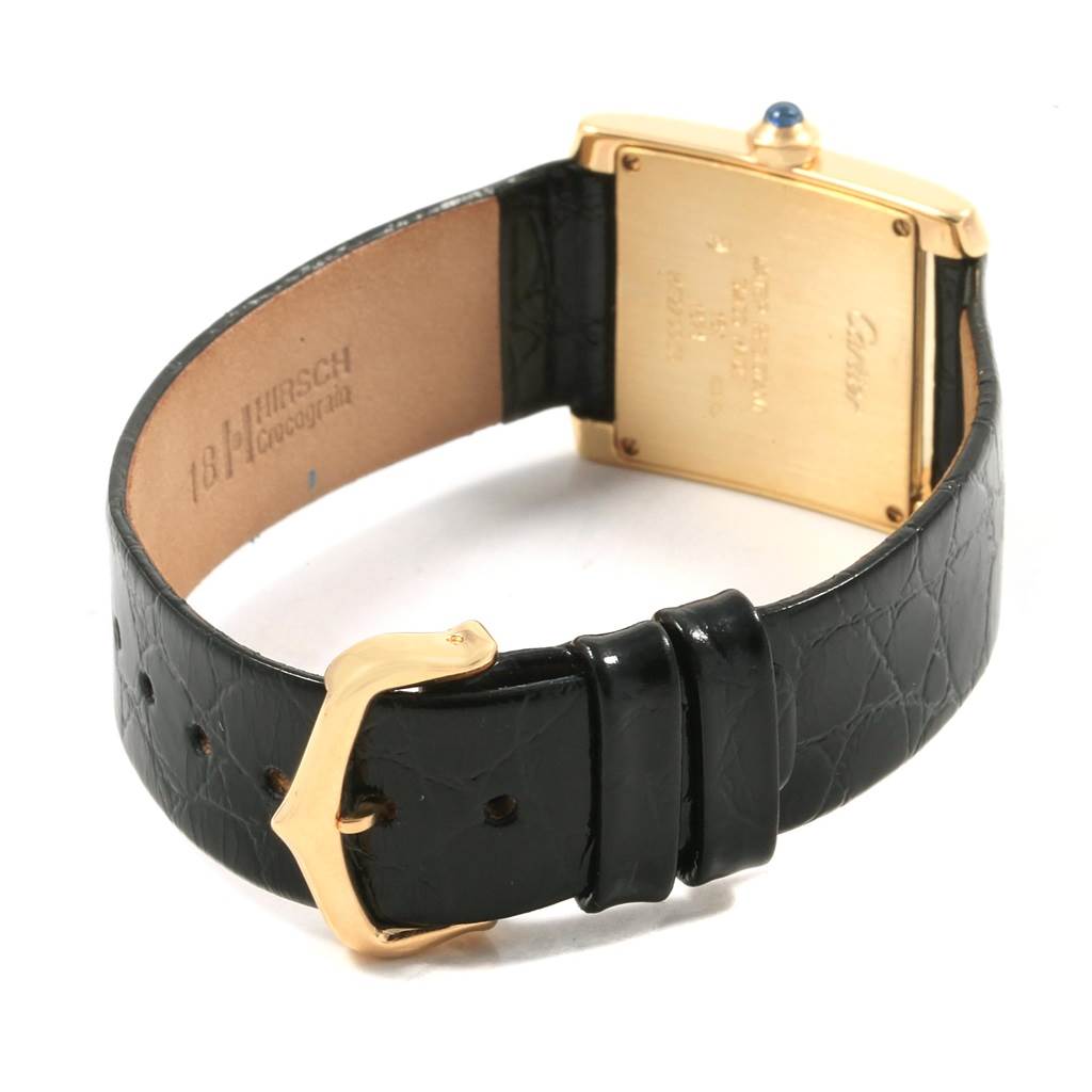 The image shows the back and leather strap of a Cartier Tank Francaise W50003N2 Women's Yellow Gold Silver Dial W50003N2 Women's Yellow Gold Silver Dial watch, including the clasp and the case back.