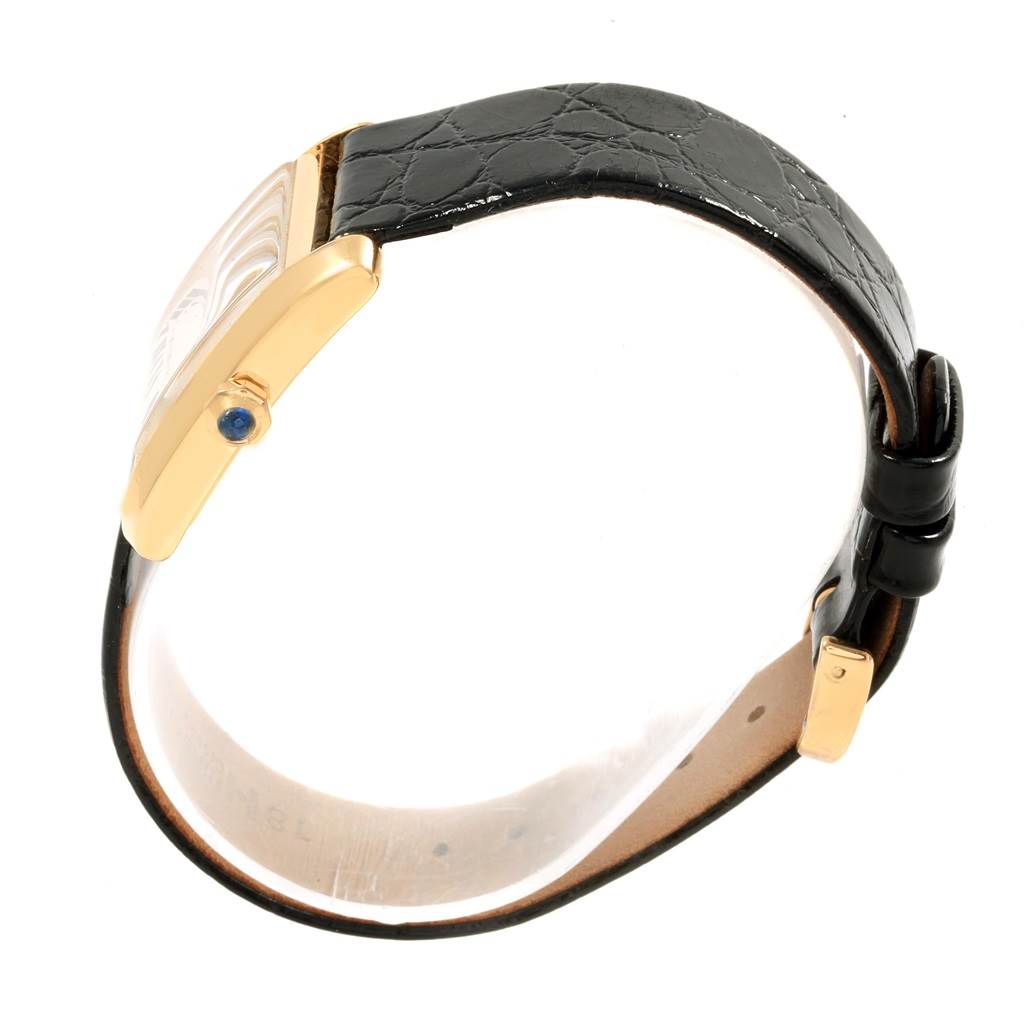 The image shows a side view of the Cartier Tank Francaise W50003N2 Women's Yellow Gold Silver Dial W50003N2 Women's Yellow Gold Silver Dial watch, highlighting the case, strap, and sapphire crown.