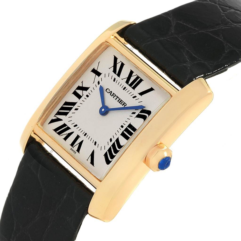 This image shows a close-up angle of the Cartier Tank Française, highlighting its dial, case, crown, and leather strap.