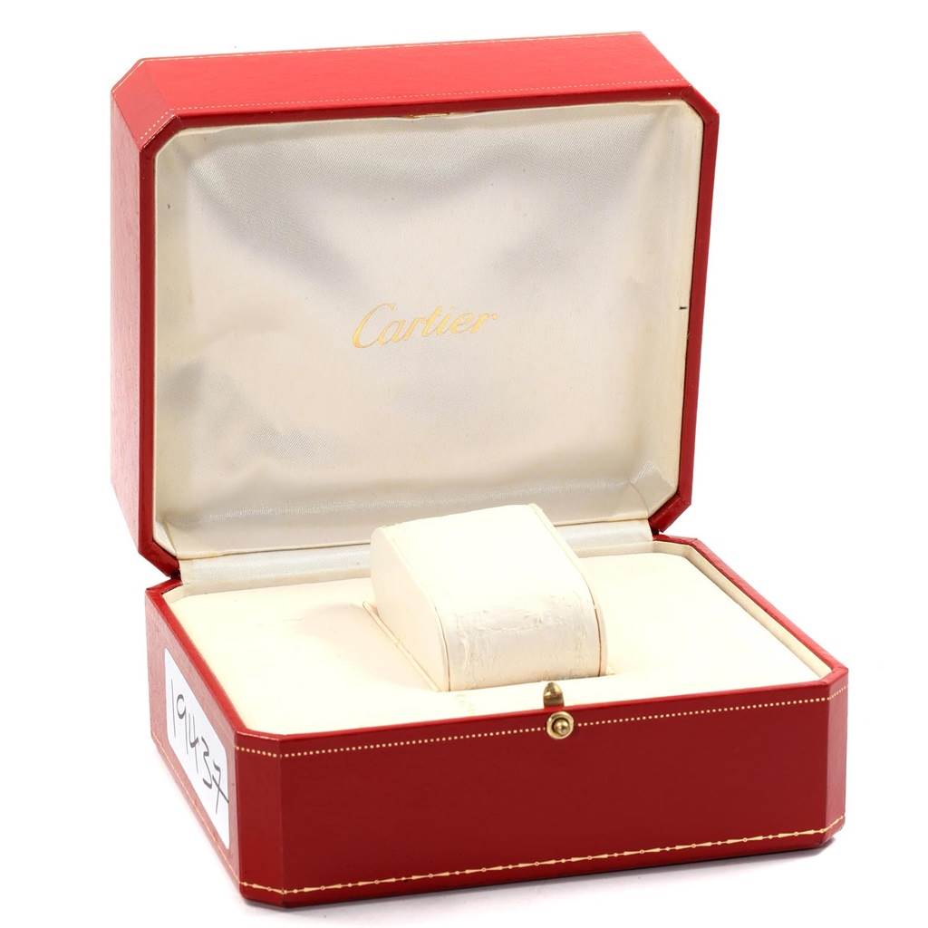 This image shows an open red Cartier box for the Tank Francaise model, with an empty watch holder inside.