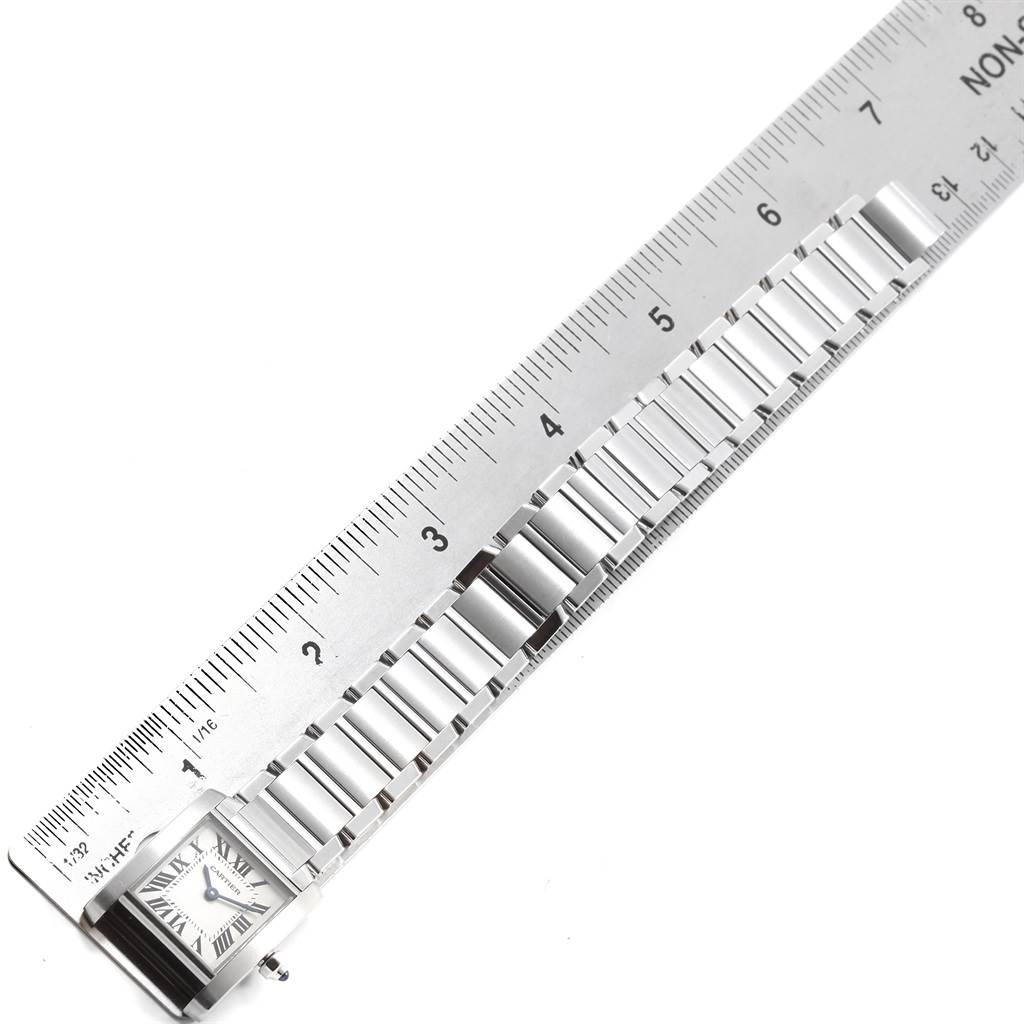 The image shows a Cartier Tank Francaise W51008Q3 Women's Stainless Steel Silver Dial W51008Q3 Women's Stainless Steel Silver Dial watch band aligned against a ruler.