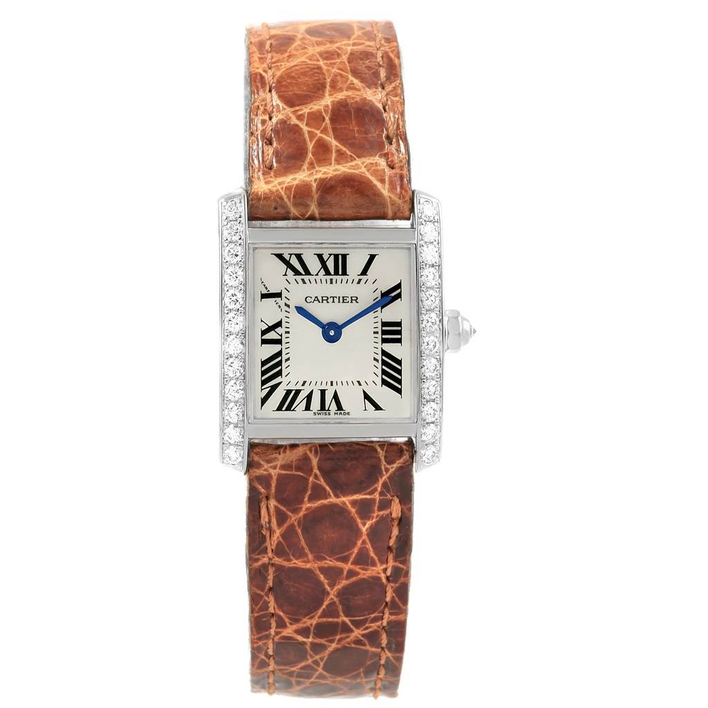 The image shows a front view of a Cartier Tank Francaise WE100231 Women's White Gold Silver Dial WE100231 Women's White Gold Silver Dial watch, featuring its brown leather strap and rectangular face with Roman numerals.