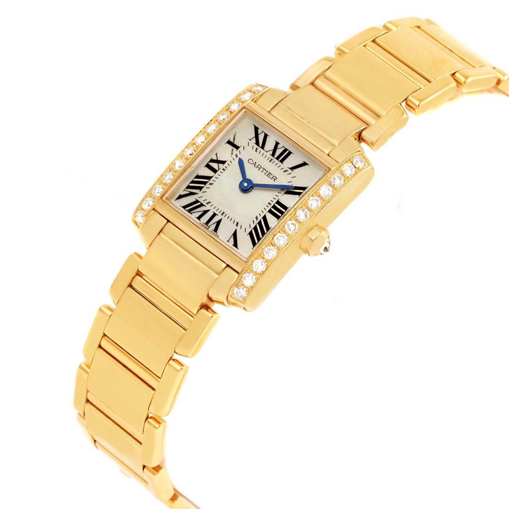 The Cartier Tank Francaise WE1001R8 Women's Yellow Gold Silver Dial WE1001R8 Women's Yellow Gold Silver Dial watch is shown at a slight angle, displaying its rectangular dial, gold bracelet, and diamond-set bezel.
