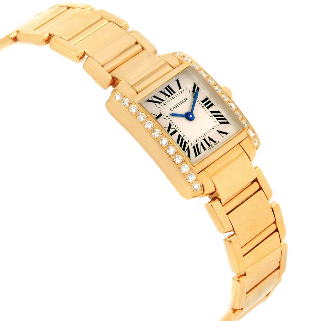 The image shows a side angle view of the Cartier Tank Francaise WE1001R8 Women's Yellow Gold Silver Dial WE1001R8 Women's Yellow Gold Silver Dial watch, highlighting its gold bracelet and diamond-set bezel.