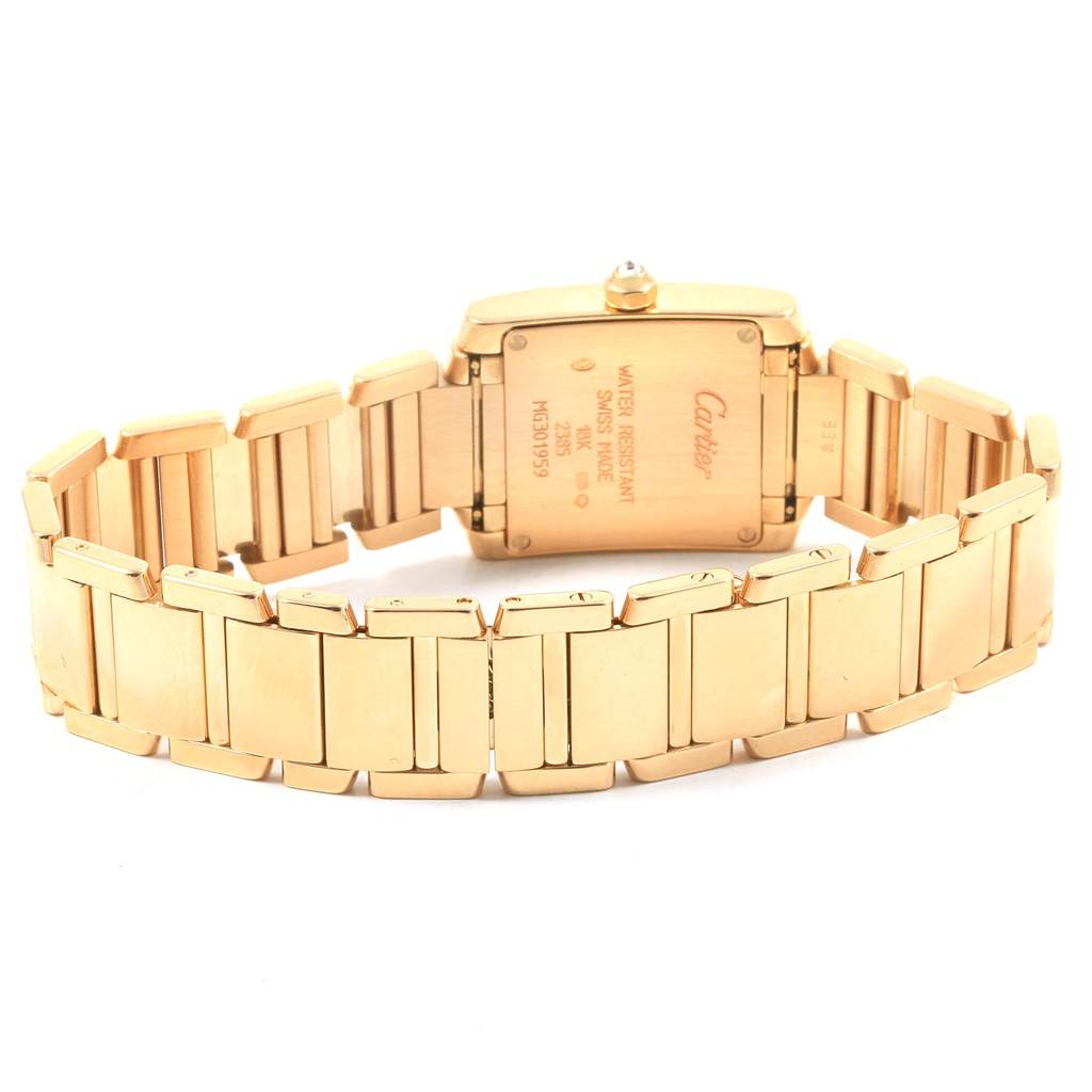 The image shows the back and bracelet of a Cartier Tank Française watch, highlighting its gold-tone case and band.